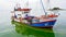 Plankton bloom sea with fishing boat background