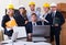 Planners with helmets in architecture bureau