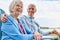 Planning for a retirement paid off. an affectionate senior couple relaxing on chairs together outside.