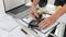 Plans and documents are placed on desks in the engineering team`s office to prepare for the meeting of the designers, engineers