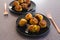 Plant-based food, deep fried risotto arancini balls with vegan cheese filling