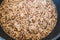 Plant-based food, tricolor quinoa seasoned with nutritionalyeast getting boiled in pot on the stove