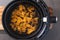 Plant-based food, vegan buffalo cauliflower florets in air fryer basket