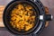 Plant-based food, vegan buffalo cauliflower florets in air fryer basket