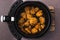 Plant-based food, vegan buffalo cauliflower florets inside air fryer