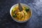 Plant-based food, vegan jackfruit curry with broccoli and onions