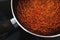 Plant-based food,  vegan lentil and textured vegetable protein ragu sauce in pot on kitchen stovetop