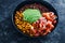 Plant-based food,  vegan mexican style nourish bowl with spicy bean chilli avodaco corn and pico de gallo