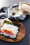 Plant-based food, vegan sushi with seaweed and sticky rice with capsicum getting prepared