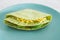 plant-based food  vegan version fo the viral layered tortilla wrap hack with red peppers grated dairy-free cheese avocado and