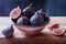 Plant-based snack ripe figs bowl on rustic wooden table dar background