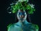 Plant crown, black woman and beauty of face with makeup on dark background with tropical leaf. Fairy model person or