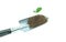 Plant on Garden trowel on white