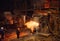 Plant for the production of steel. An electric melting furnace. Factory worker takes a sample for metal.