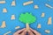 Plant a tree, reforestation and deforestation concept. Young male hands holding a tree in blue background.