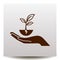 Plant vector icon with human hand on a realistic paper backgroun