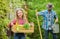 Plant veggies. Planting season. Family dad and daughter little girl planting plants. Day at farm. Popular in garden care