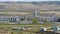 Plant with workshops against mountains aerial view