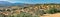 Plantation of olives on the background of the blue sky. View of olive tree fields and countryside. Olive trees in rows