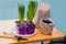 Planting hyacinths at home on a yellow table. ground paper bag, drainage, tools