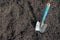 Planting shovel in the ground, gardening preparation of a bed in spring time on a sunny day