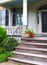 Plants in Pots Adorn Stone Steps at Entrance to a Building