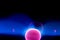 Plasma electric ball lightning lamp. Fascinating space video  close-up of electrical discharges with blue flames on a dark