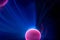 Plasma electric ball lightning lamp. Fascinating space video  close-up of electrical discharges with blue flames on a dark