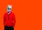 Plaster statue of Apollo`s in blue sunglasses and earphone. Minimal concept art. On a orange background