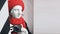 plaster statue in a red beret and scarf with a camera in his hands. Photography art symbol