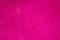 Plaster wall fuchsia or Magenta. Fashionable background to copy space and lettering