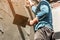 Plasterer concrete worker at wall of house