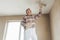 Plasterer putting plaster on a ceiling