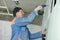 Plasterer worker with gypsum board