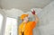 Plasterwork and painting preparation. craftsman applying plaster or filling on ceiling