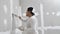 Plasterwork and wall painting preparation. Asian male applying filling drywall patch