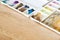 Plastic artist color palette on wooden floor