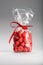 Plastic bag of acidulous strawberries isolated with elegant red