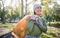 Plastic bag, park and woman cleaning in eco friendly, climate change or community service project for volunteering