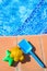 Plastic beach toys near pool