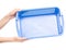 Plastic blue laundry basket in hand