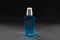 Plastic bottle blue sanitizer. Black background
