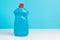 Plastic bottle with dishwashing detergent.