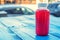 Plastic bottle with red fruit drink in restaurant