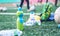 Plastic bottles with blurry soccer training equipment on artificial turf. It is waste from soccer training or football