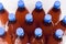 Plastic bottles with home made craft beer on white background. Craft beer brewing from grain barley pale malt. Ale or lager from