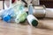 Plastic bottles, paper and metal cans are scattered across the kitchen floor