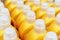 Plastic bottles of yellow color with detergent. Cans with household liquid on a shop window. Selective focus. Close-up