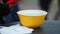 Plastic bowl of hot soup served outdoors for menial workers, cheap instant lunch