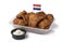 Plastic bowl with traditional Dutch kibbeling and sauce